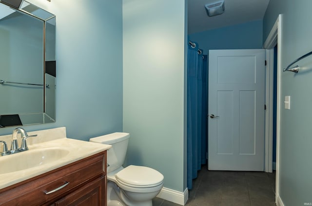 bathroom featuring tile patterned flooring, toilet, vanity, visible vents, and baseboards