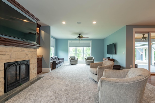 carpeted living area with recessed lighting, a fireplace, baseboards, and ceiling fan