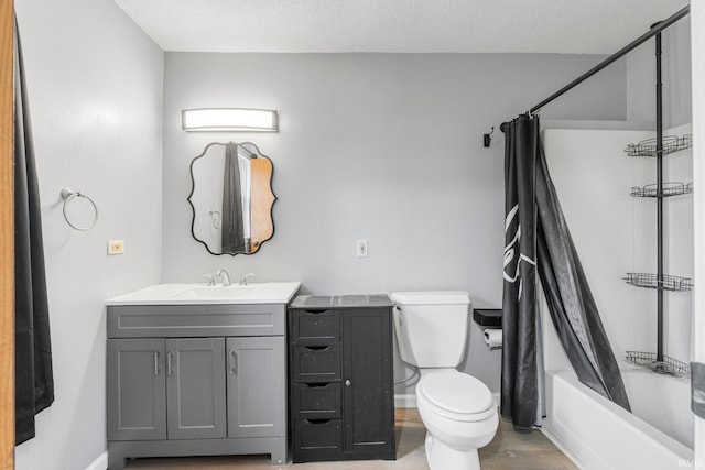 bathroom with a textured ceiling, toilet, vanity, baseboards, and shower / bath combo with shower curtain