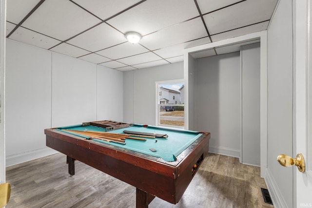 game room with pool table, visible vents, a drop ceiling, and wood finished floors