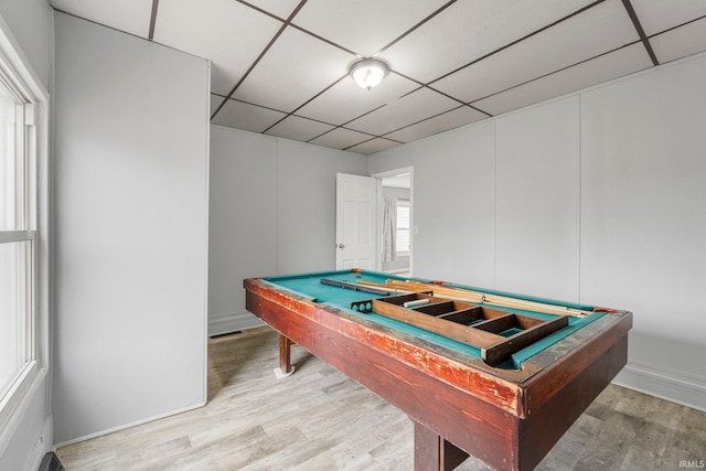 game room with pool table, a drop ceiling, and wood finished floors