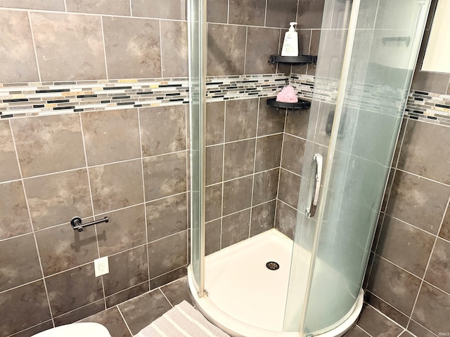 full bath with a shower stall