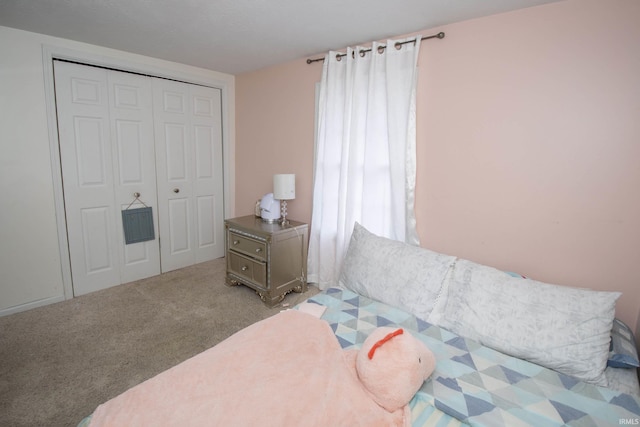 carpeted bedroom featuring a closet