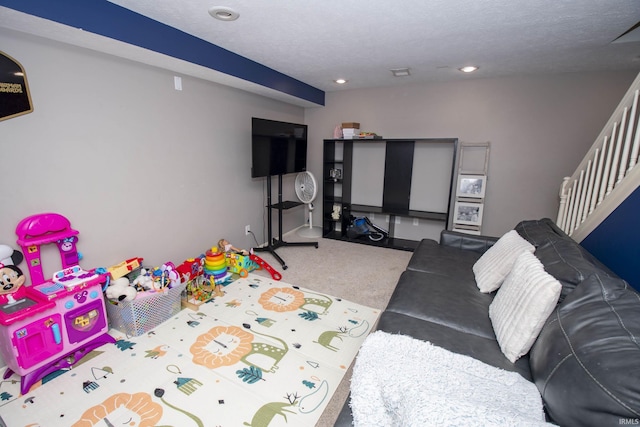 game room featuring a textured ceiling and recessed lighting