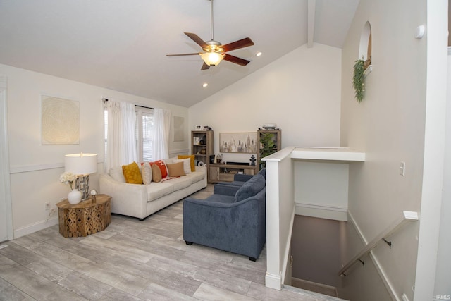 living area with recessed lighting, light wood-style flooring, a ceiling fan, beamed ceiling, and baseboards