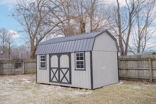 view of shed with a fenced backyard