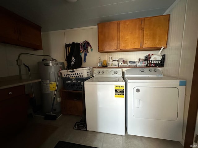 laundry room with cabinet space, washing machine and clothes dryer, and electric water heater