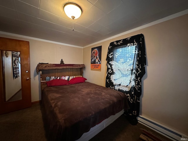 bedroom with a baseboard heating unit, dark carpet, and crown molding