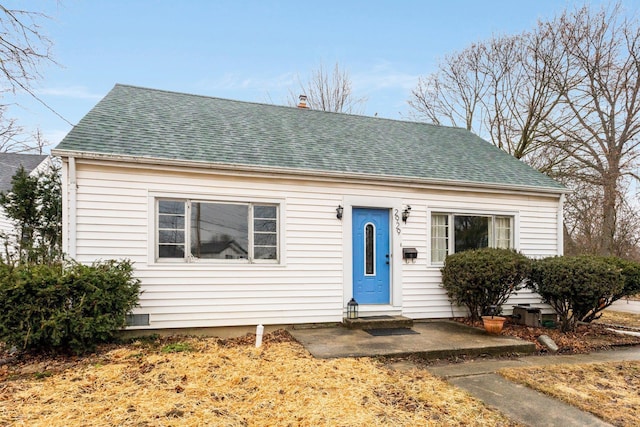 bungalow featuring crawl space, a shingled roof, and entry steps