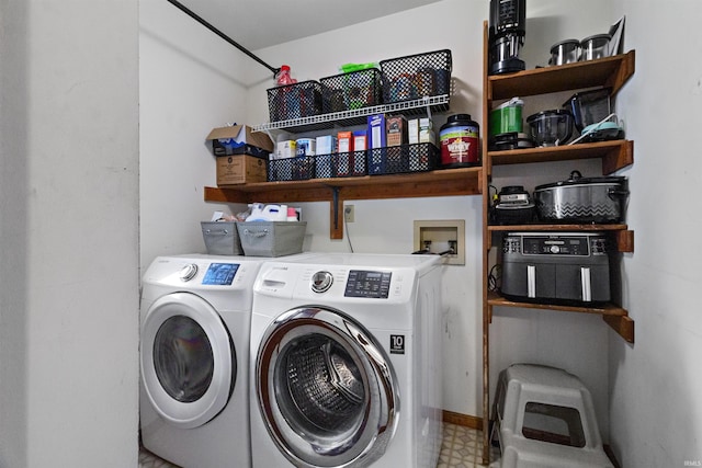 washroom with washer and dryer, laundry area, and tile patterned floors