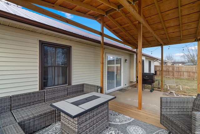 deck featuring a grill and fence