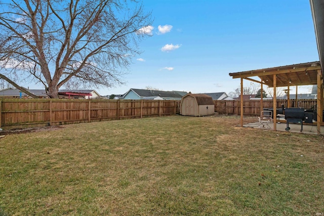 view of yard featuring a fenced backyard, a shed, an outdoor structure, and a patio