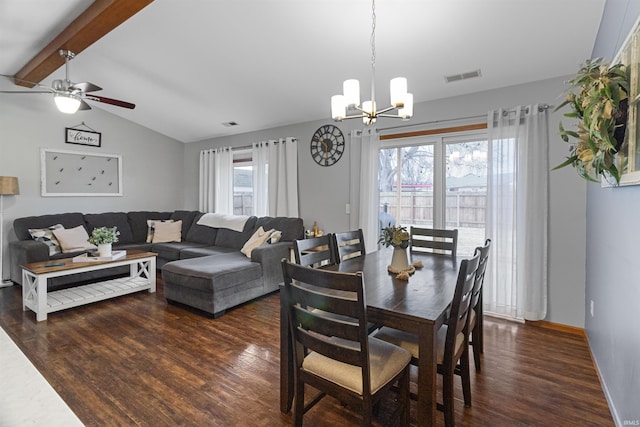 dining area featuring baseboards, visible vents, lofted ceiling with beams, dark wood-style floors, and ceiling fan with notable chandelier