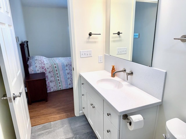 bathroom with vanity and toilet