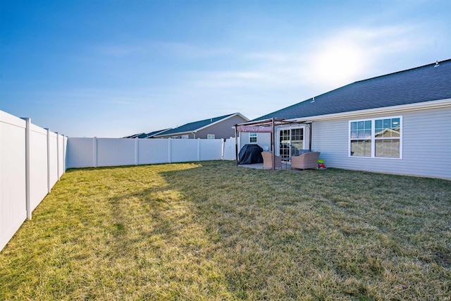 view of yard featuring a patio area and a fenced backyard