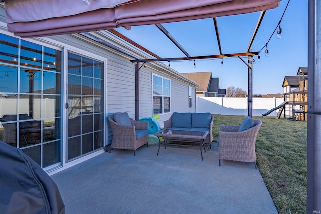 view of patio / terrace with a playground, outdoor lounge area, and a fenced backyard