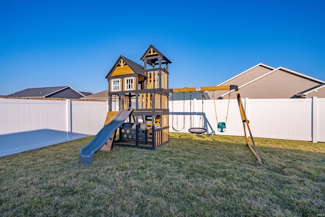 view of play area featuring a fenced backyard and a yard