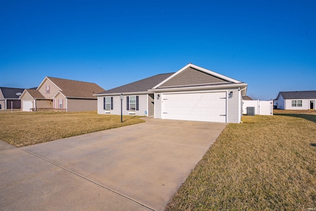 ranch-style home featuring an attached garage, driveway, and a front lawn