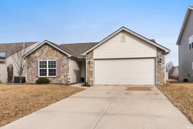 ranch-style home with a shingled roof, a front yard, driveway, and an attached garage