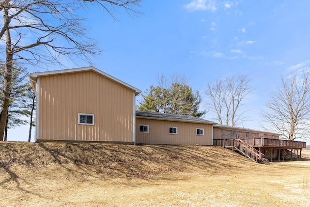 view of outbuilding featuring stairway