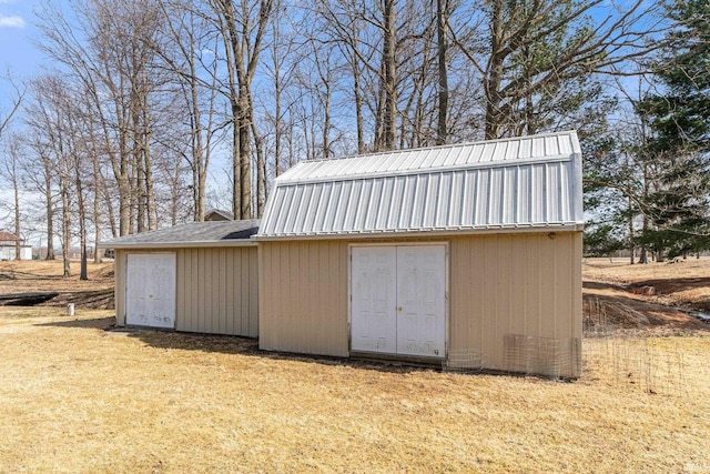 garage featuring a storage unit