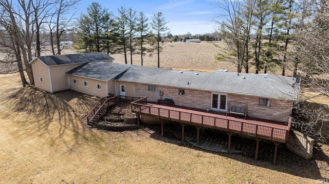 back of house with french doors, a shingled roof, and a wooden deck