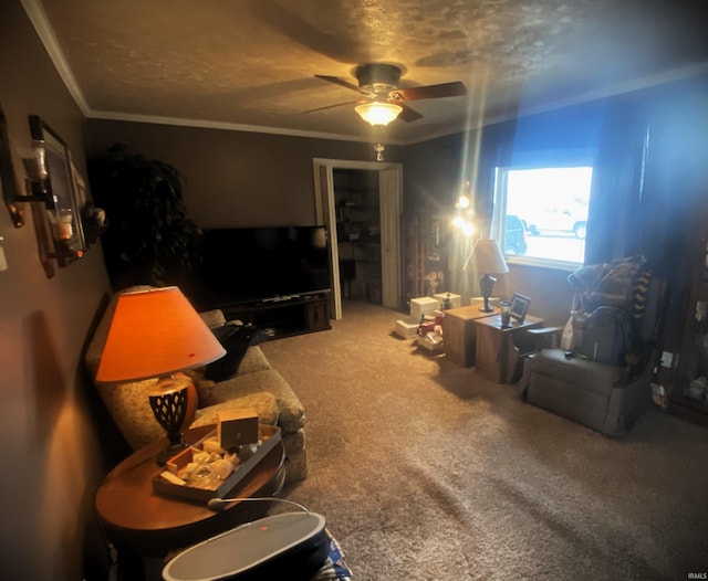 carpeted living room with crown molding, a textured ceiling, and ceiling fan