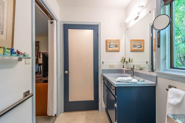 bathroom with vanity and tile patterned floors