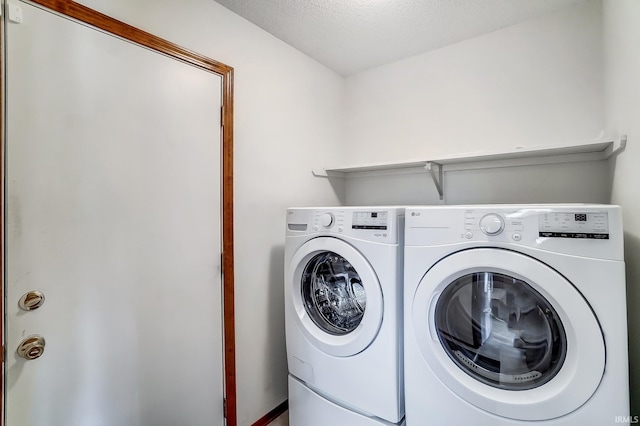 laundry area with laundry area and separate washer and dryer