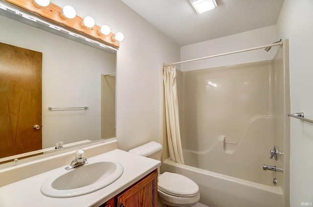 full bath featuring toilet, a textured ceiling, shower / bath combination with curtain, and vanity