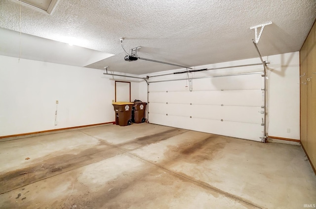 garage with a garage door opener and baseboards