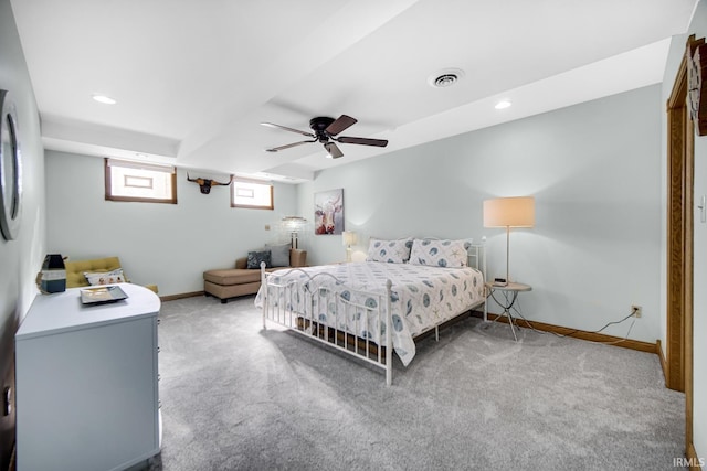 carpeted bedroom featuring recessed lighting, visible vents, baseboards, and a ceiling fan