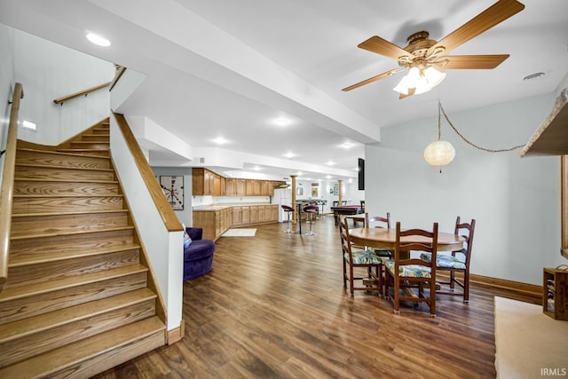 dining area featuring stairway, a ceiling fan, baseboards, recessed lighting, and dark wood-type flooring