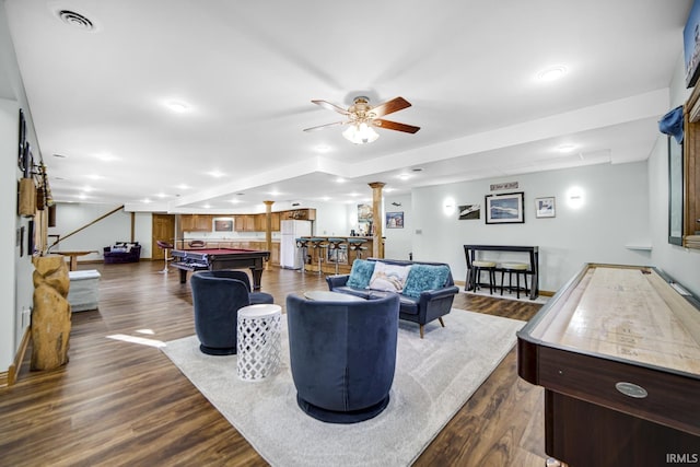 living area with visible vents, pool table, dark wood finished floors, a dry bar, and decorative columns