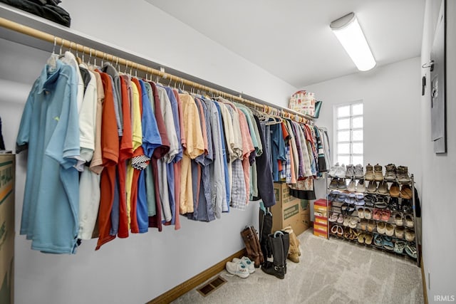 spacious closet with visible vents and carpet floors