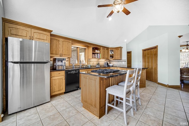 kitchen with lofted ceiling, freestanding refrigerator, black dishwasher, dark countertops, and a center island