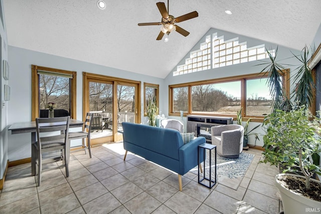 living room with recessed lighting, a textured ceiling, light tile patterned flooring, and a ceiling fan