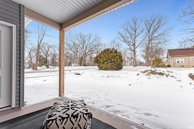 view of yard layered in snow