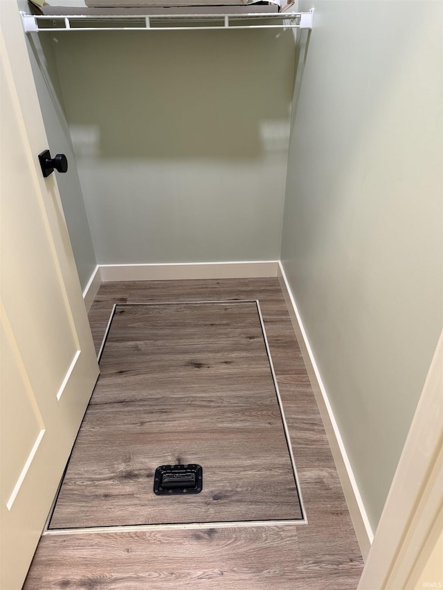 spacious closet with wood finished floors