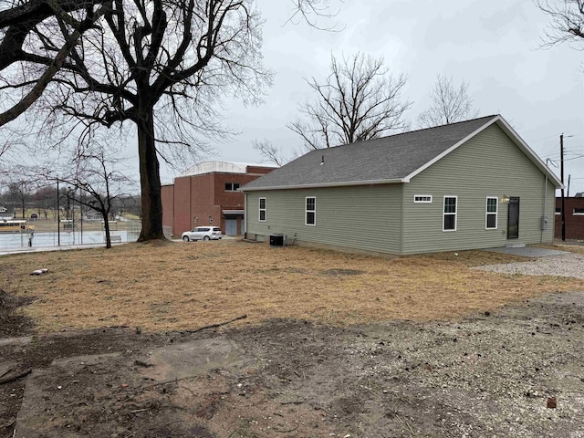 rear view of property featuring cooling unit