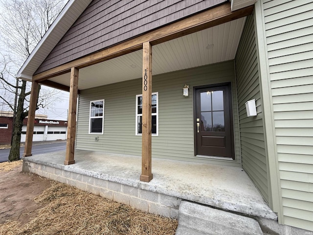 doorway to property with covered porch