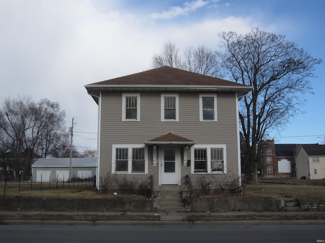 view of front of property with a garage and fence