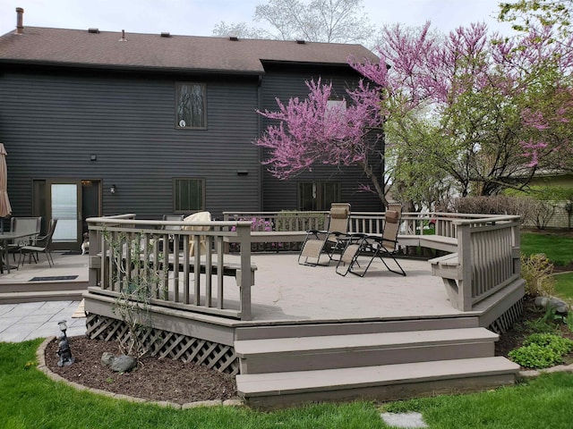 wooden terrace with outdoor dining area