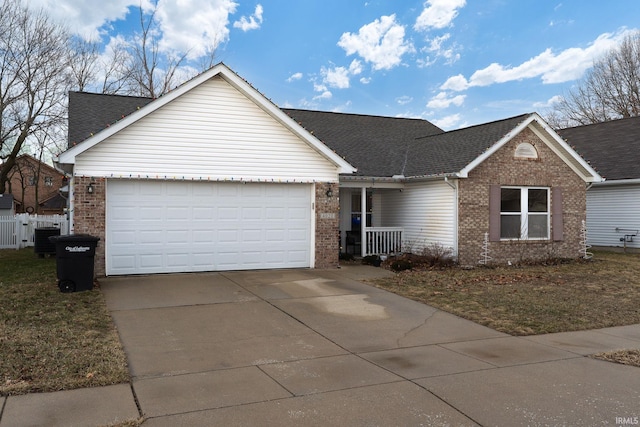 single story home featuring a garage, driveway, brick siding, and roof with shingles