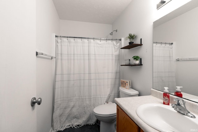 bathroom with a shower with curtain, a textured ceiling, toilet, and vanity