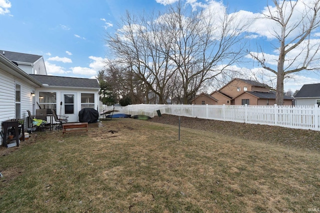 view of yard with a fenced backyard