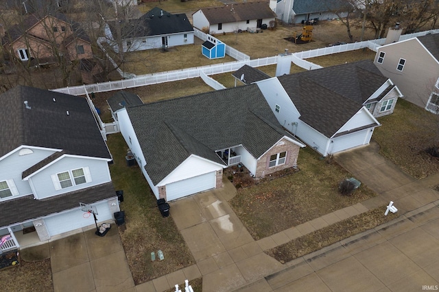 birds eye view of property with a residential view