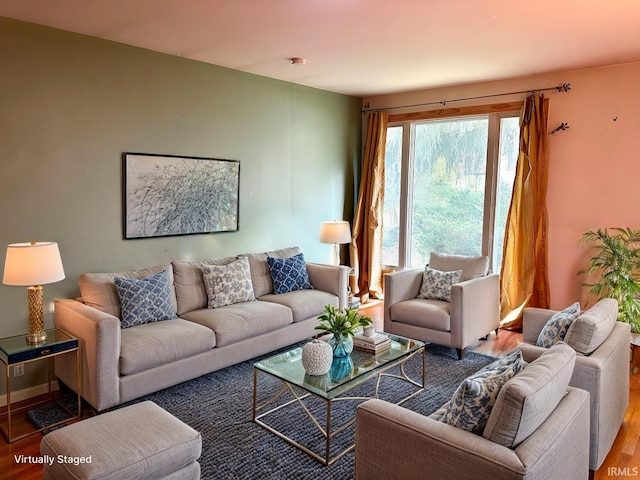 living room with baseboards and wood finished floors