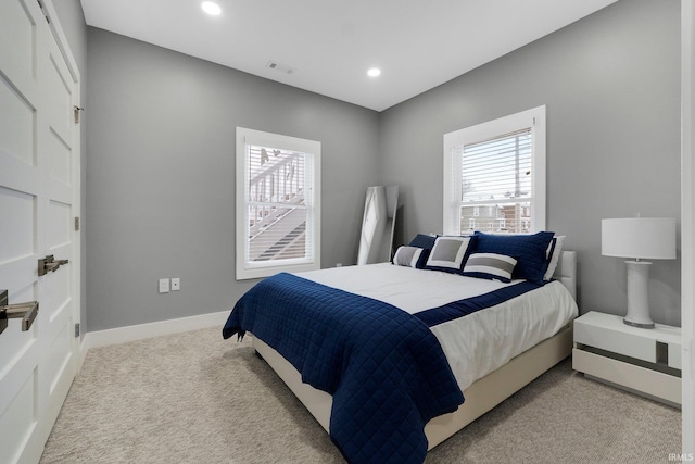 bedroom featuring carpet floors, recessed lighting, visible vents, and baseboards