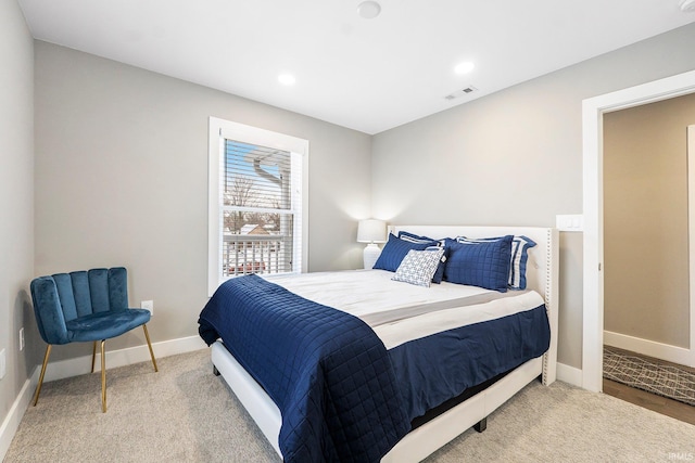 carpeted bedroom featuring recessed lighting, visible vents, and baseboards